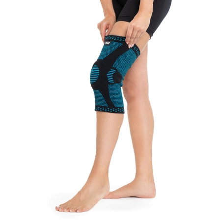 Rugalmas térdszorító térdkalács-stabilizátorral, L, kék
